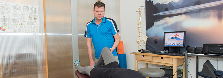 Chiropractor Amsterdam NH J.G. Drewry Assessing Patient