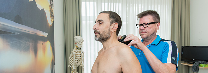 Chiropractor Amsterdam NH J.G. Drewry Examining Patients Shoulders Chiropractor Amsterdam NH J.G. Drewry Examining Patients Shoulders